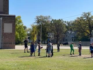 Homecoming King and Queen - Caleb Bray and Katie Anderson went out during recess today to hang out with elementary students , they enjoyed swinging and playing a little football. 